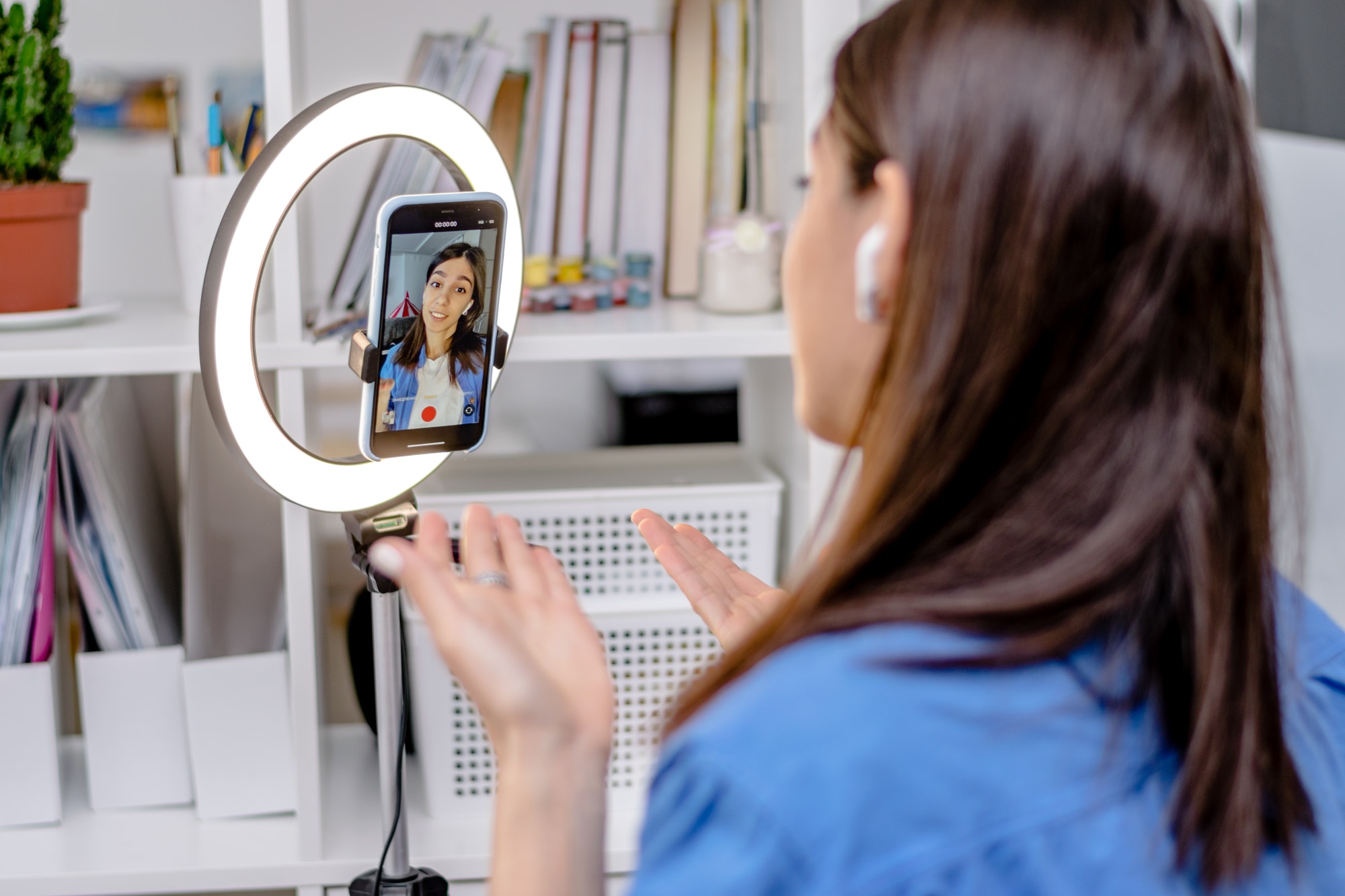 girl-blogger-influencer-talking-smartphone-live-recording-video-blog-on-social-network-at-home-1-1.jpg