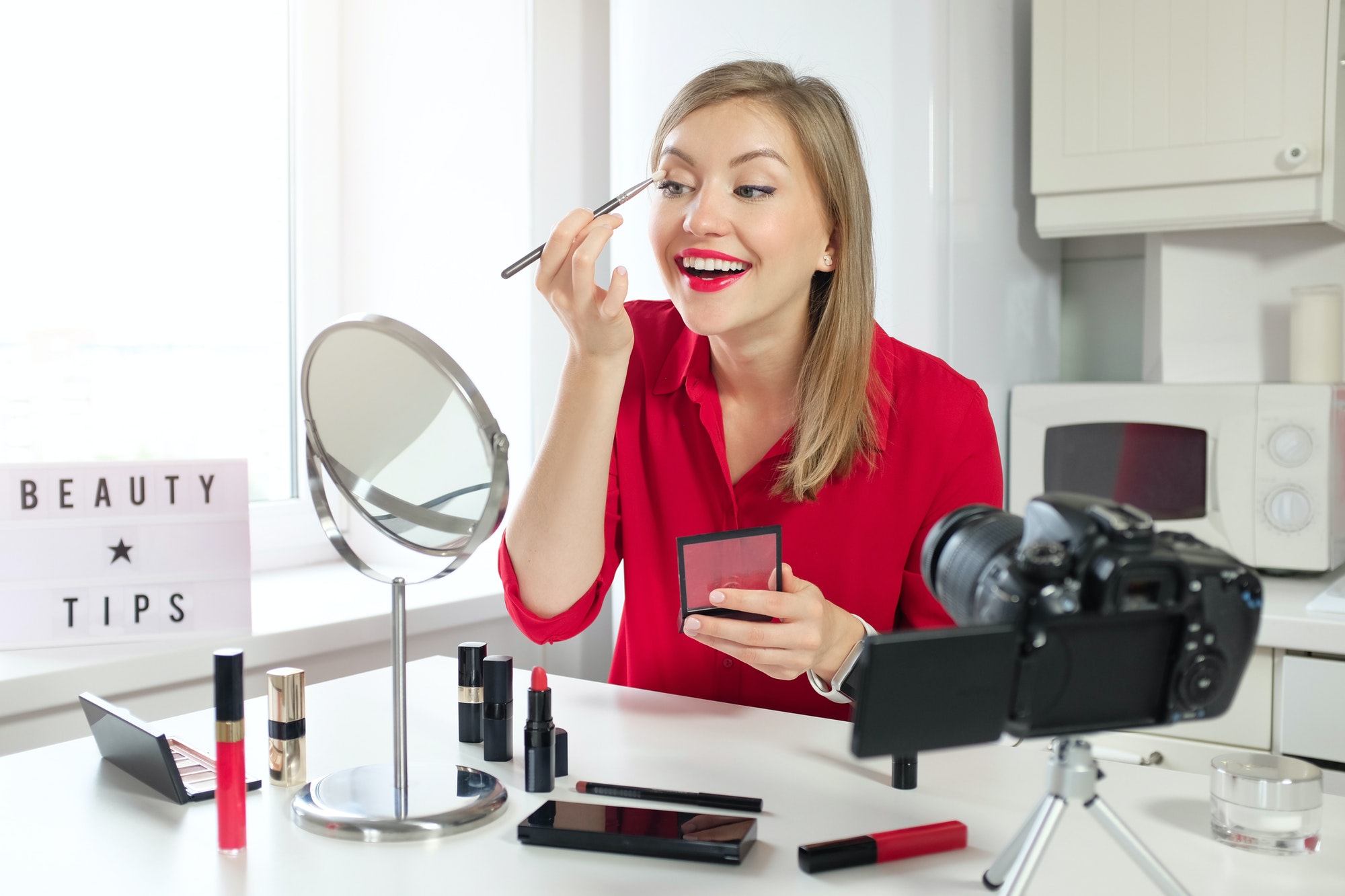 stylish-young-woman-blogger-recording-make-up-video-guide-on-beauty-tips.jpg